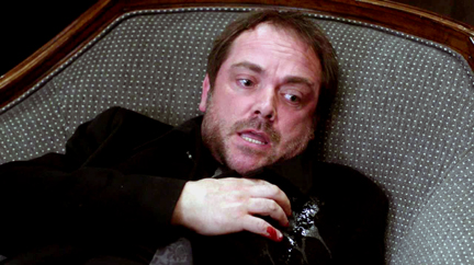 Crowley is hit in the shoulder with a devil's trap bullet.